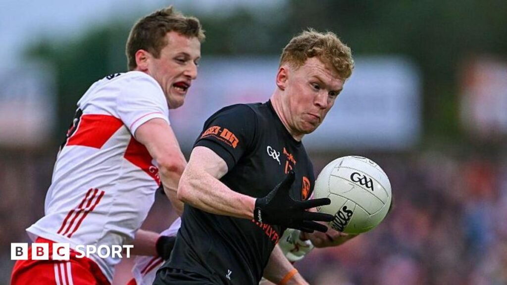 Derry's Brendan Rogers in action against Conor Turbitt of Armagh