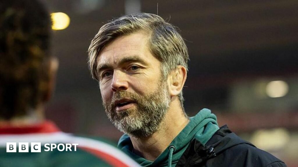 Leicester Tigers: Play-off expectation ‘great pressure to have’ – Geoff Parling Leicester Tigers head coach Geoff Parling. He is wearing a green jumper and has a slight smile on his face.