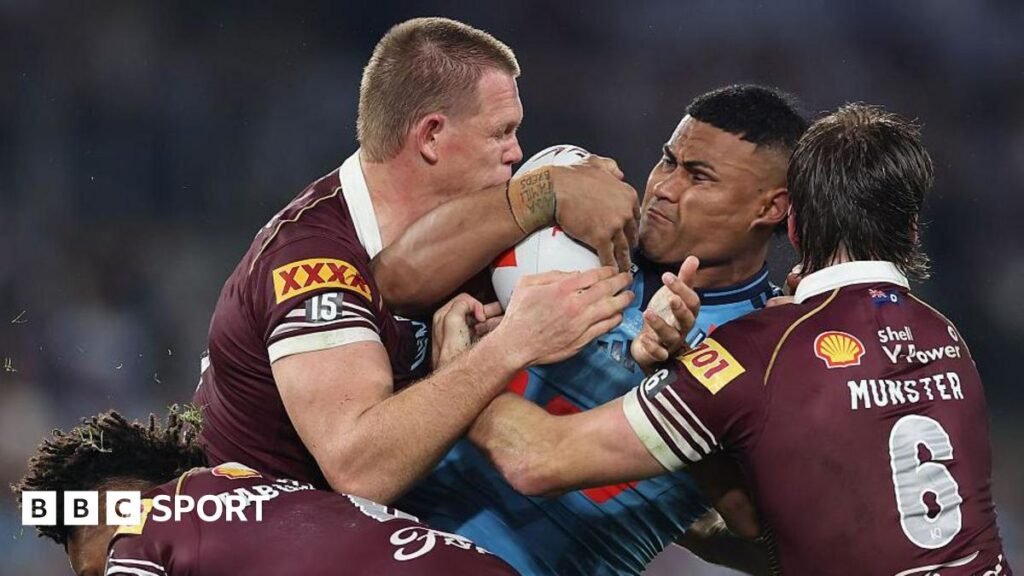 Haumole Olakau'atu of New South Wales is tackled during the game