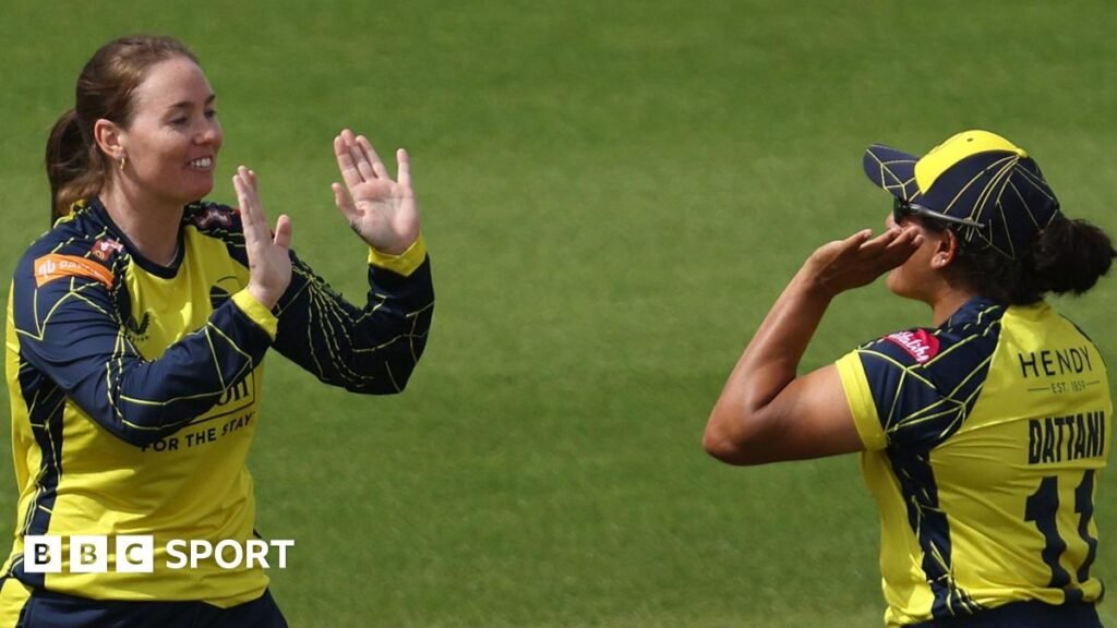 Amanda-Jade Wellington of Hampshire Hawks Women celebrates claiming a wicket with team-mates
