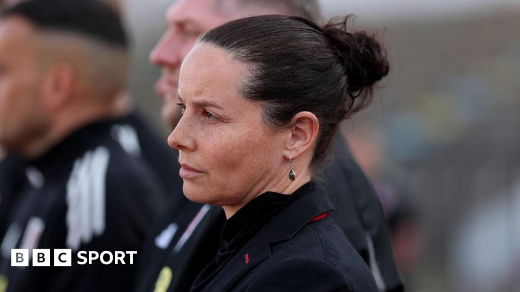 Wales boss Rhian Wilkinson lines up for the anthem