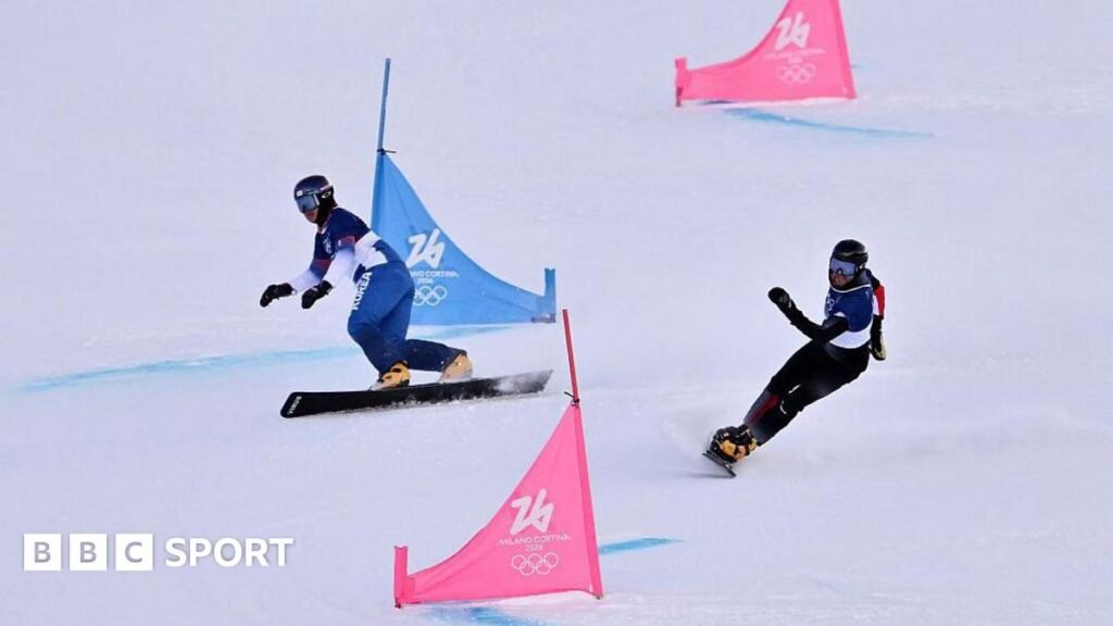 South Korea's Kim Sangkyum and Austria's Andreas Prommegger compete in the snowboard men's parallel giant slalom qualification run during the Milan-Cortina 2026 Winter Olympics