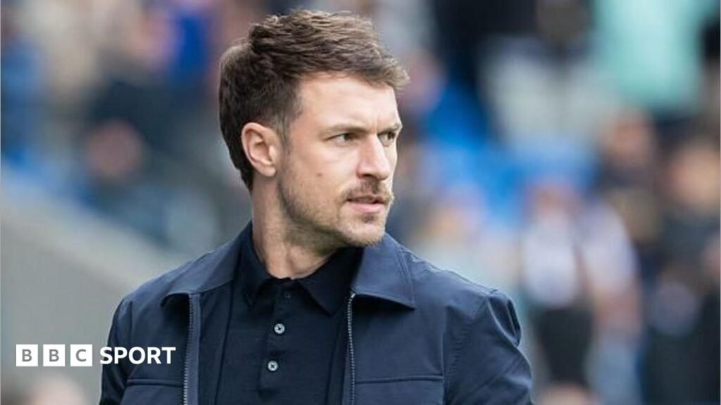 Aaron Ramsey: Oxford United appoint ex-Arsenal midfielder as head coach Aaron Ramsey stands on the sidelines as Cardiff City interim head coach