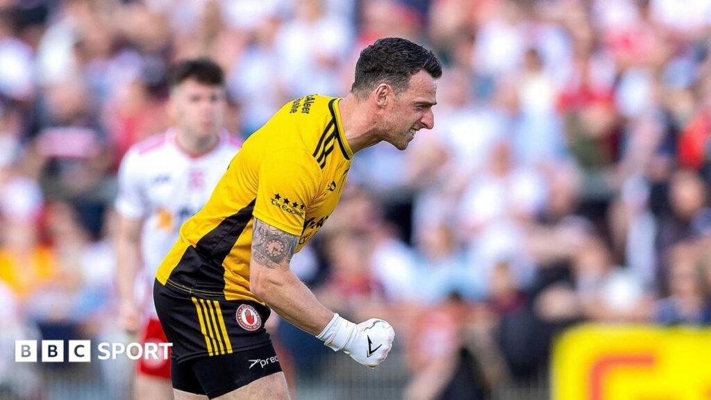 Tyrone keeper Niall Morgan celebrates his late winner against Mayo