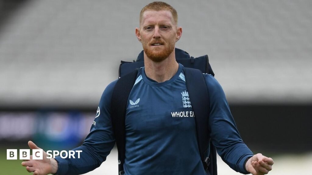 England captain Ben Stokes pictured wearing a backpack and his arms outstretched by his side