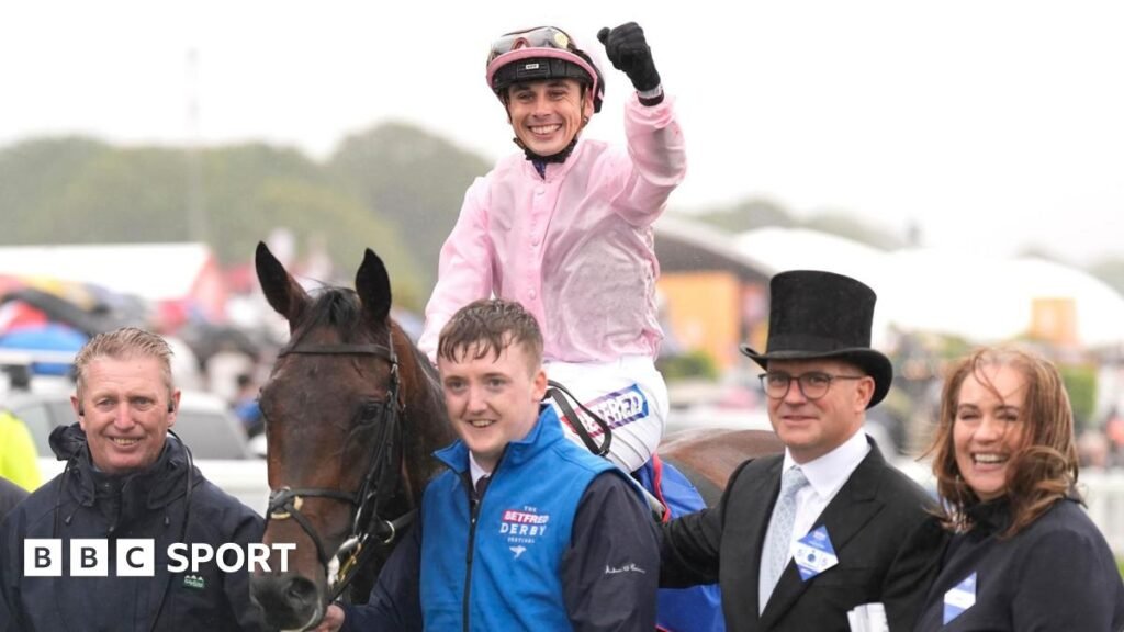Christmas Day surges to Derby win at Epsom for Aidan O’Brien Jockey Ronan Whelan celebrates winning the Derby by punching the air while still saddling Christmas Day as he returns to the paddock