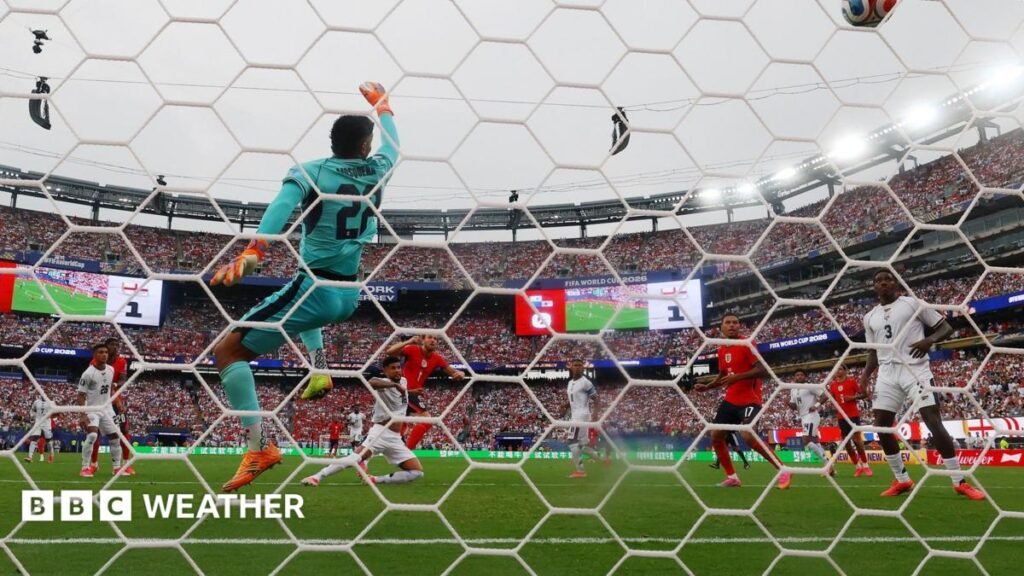 A view through the net from behind the goal as England score against Panama
