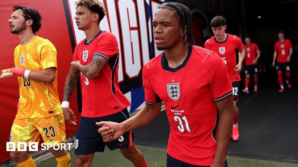 Liverpool’s Rio Ngumoha to leave England World Cup camp having impressed Tuchel Ngumoha, wearing a red England shirt, walks out of the tunnel for the second half of their game against New Zealand