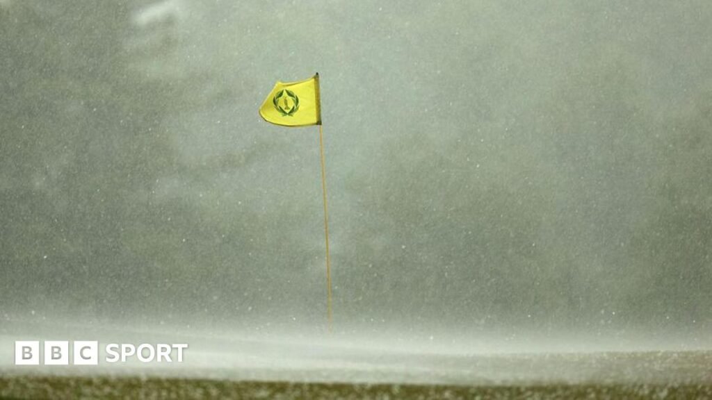Memorial Tournament third round suspended because of thunderstorms A flag billowing in the wind in heavy rain