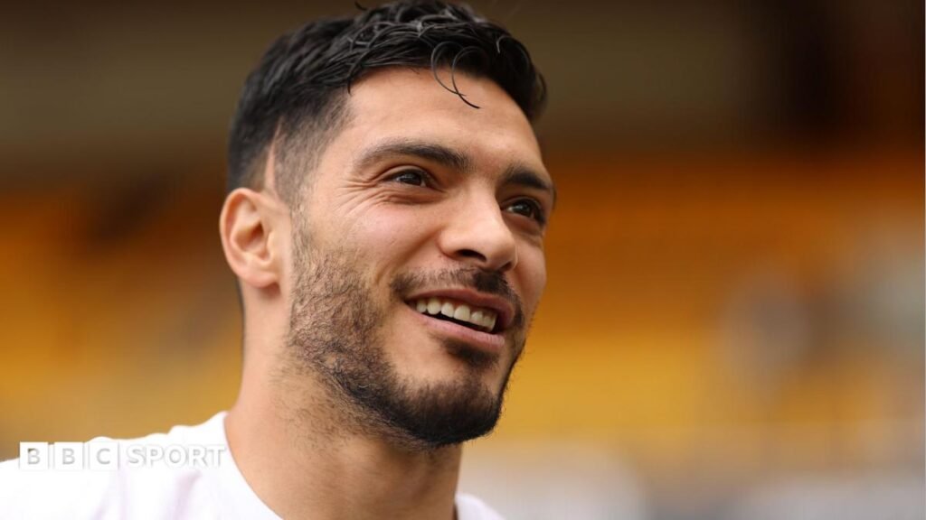 Raul Jimenez in a white Fulham club T-shirt with a cheerful face and dark facial hair