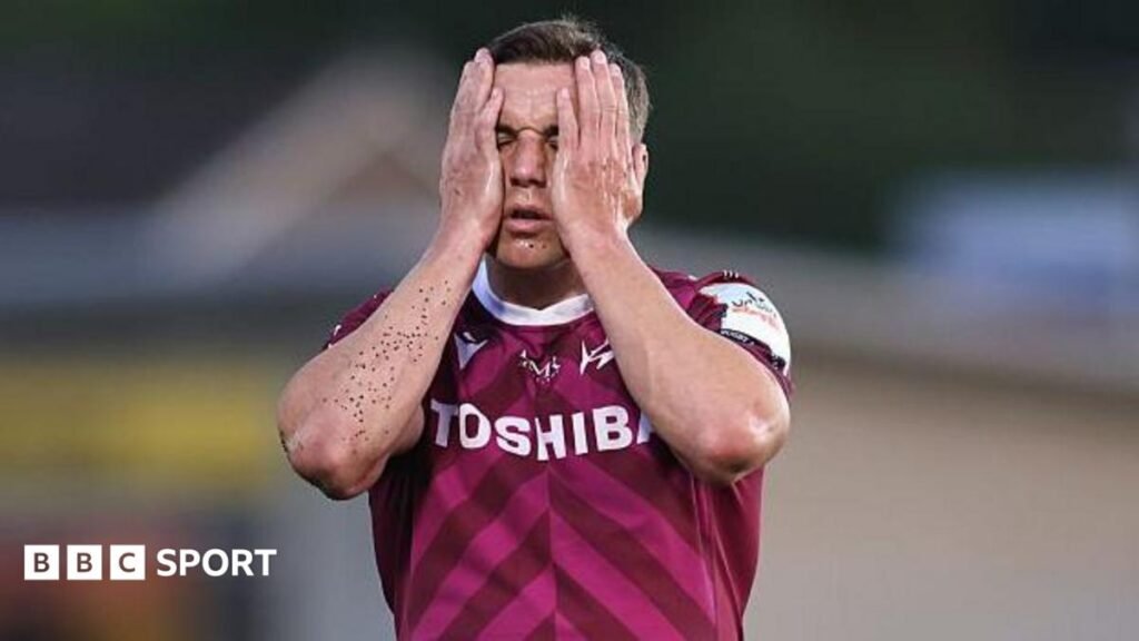 Sale Sharks: Blip or decline after season of strife for Prem club? George Ford with his two hands on his face during Sale's defeat away to Newcastle. He is wearing Sale's pink away kit and has black astro turf granules on his right arm.
