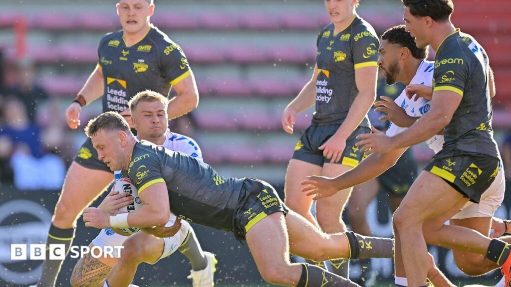 Leeds Rhinos' Harry Newman diving for the try line