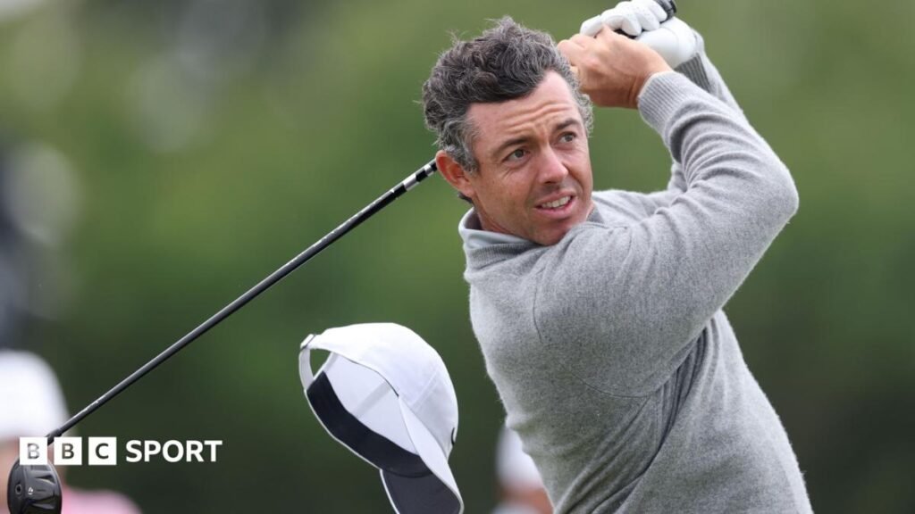 Rory McIlroy's cap flies off on the 13th hole