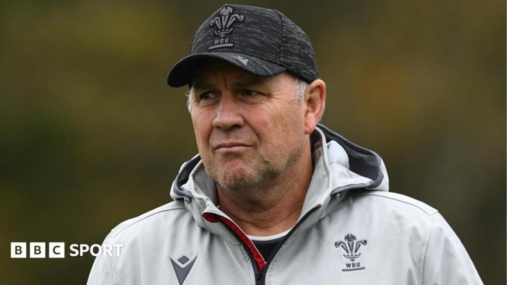 Wayne Pivac in Wales kit and a baseball cap