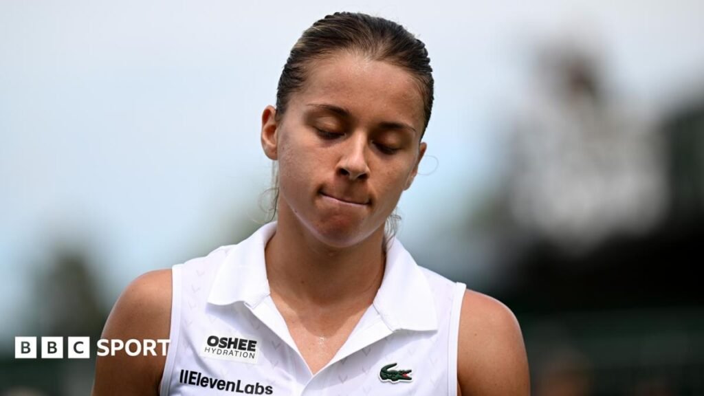 Maja Chwalinska grimaces after falling during her Wimbledon first-round match