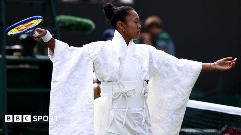 Naomi Osaka wears an all-white kimono as she prepares to warm-up before her first-round match at Wimbledon