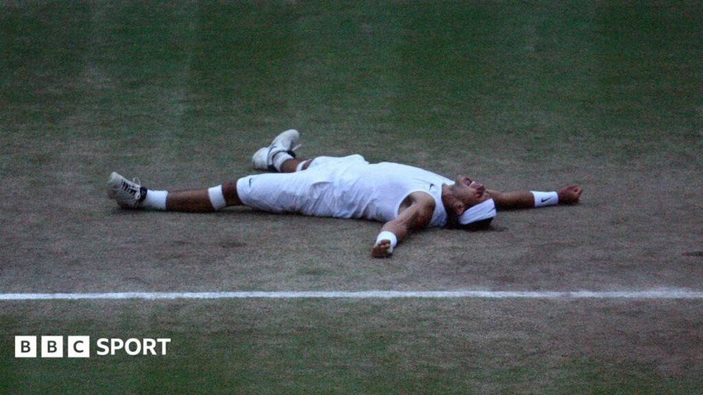 Rafael Nadal bites the Wimbledon trophy
