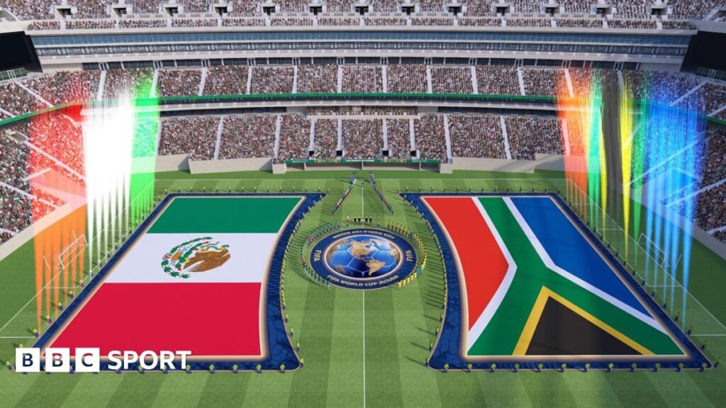 An illustrative image of the opening match of the World Cup between Mexico and South Africa with extra-large flags and all players stood around the centre circle