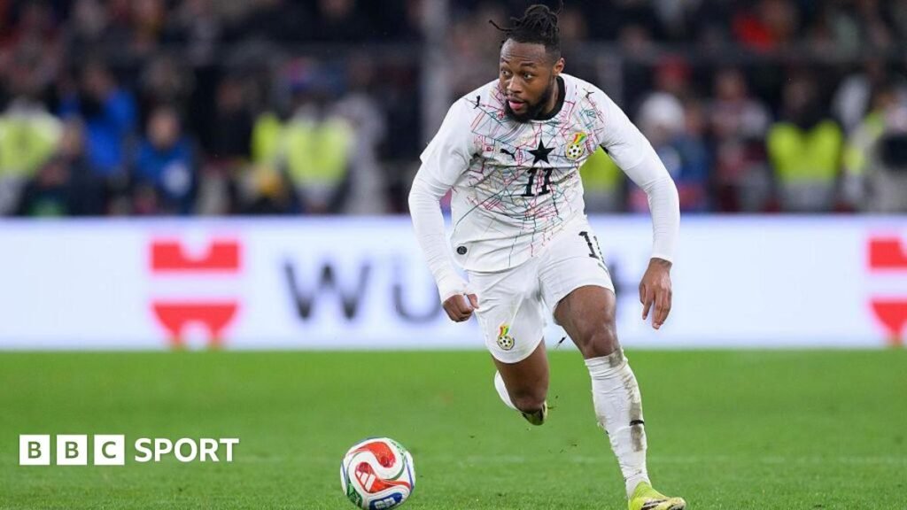 Antoine Semenyo runs with the ball in a white Ghana strip