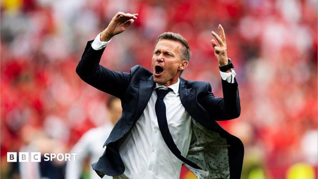 Jesse Marsch celebrates after Canada beat Qatar