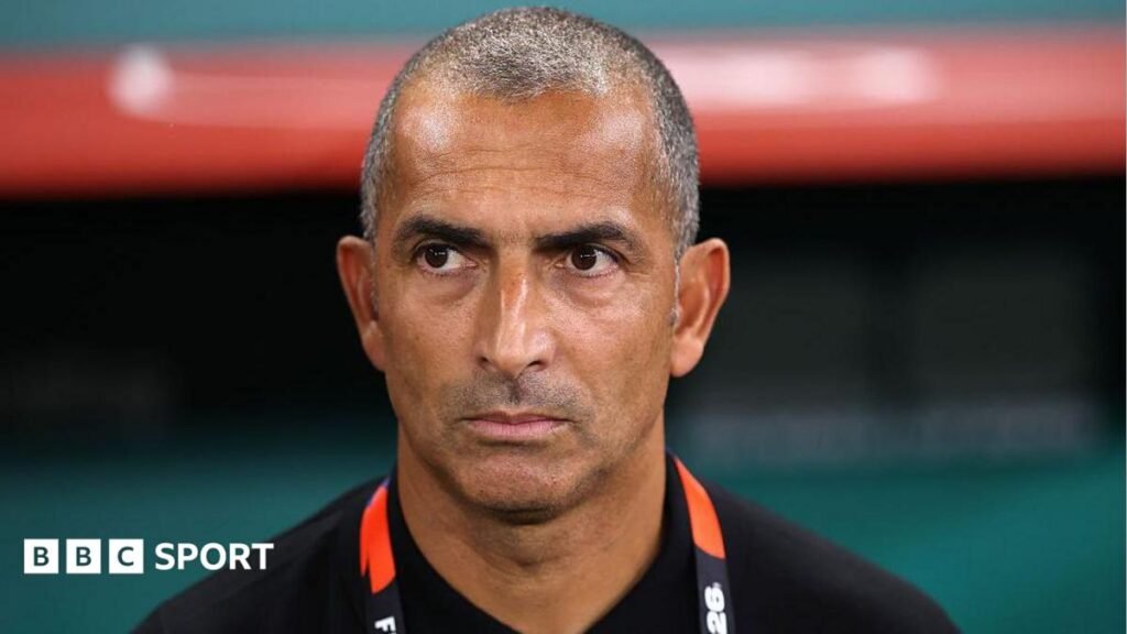 World Cup 2026: Tunisia sack Sabri Lamouchi after just one game at tournament Close up of Sabri Lamouchi standing in the dugout looking focused