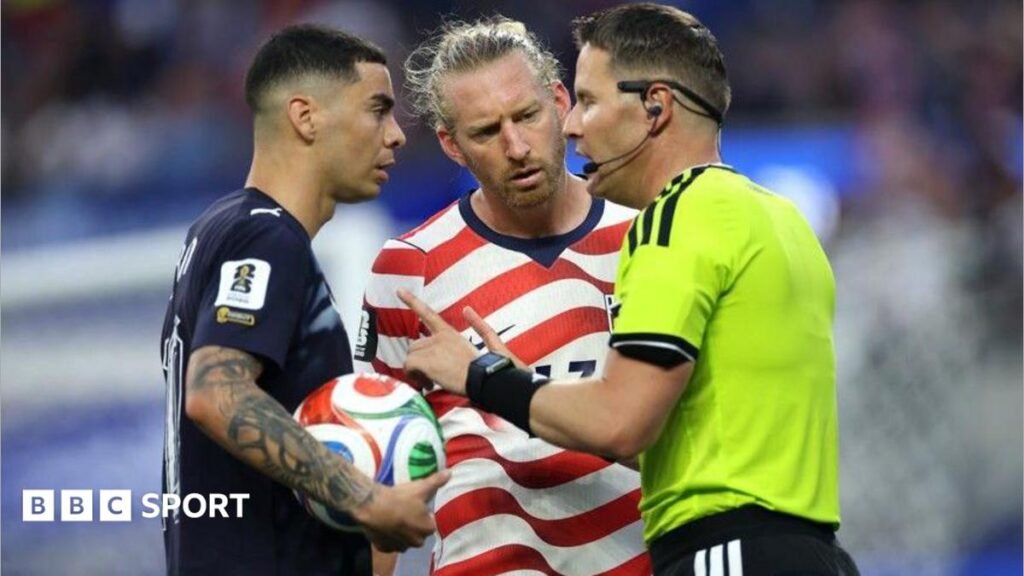 World Cup 2026: VAR makes ‘mistaken identity’ history as strange booking confuses fans Referee Danny Makkelie speaks to the Miguel Almiron of Paraguay and USA defender Tim Ream during a VAR check for 'mistaken identify'