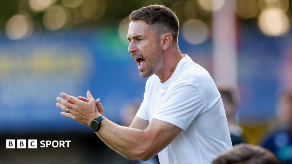 Aaron Ramsey encourages his players from the sidelines