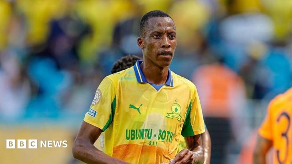 Divine Lunga: Zimbabwean football star survives South Africa gun attack Footballer Divine Lunga is seen during a match in a yellow and green Mamelodi Sundowns shirt