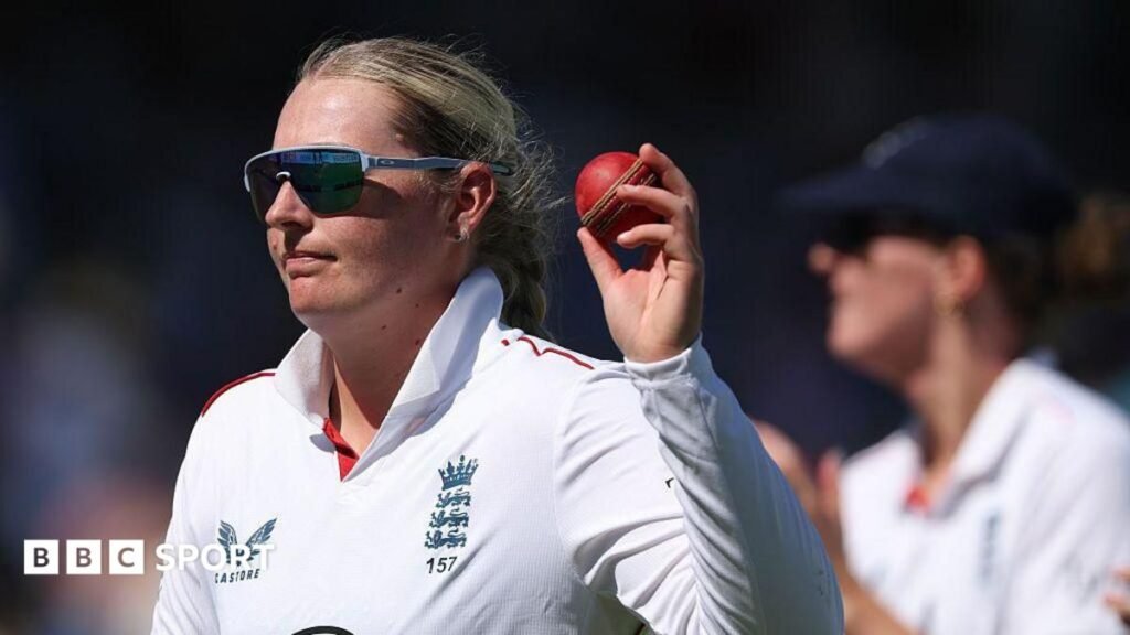 England captain Heather Knight smiles in the England team huddle before the start of play on day three against India at Lord's