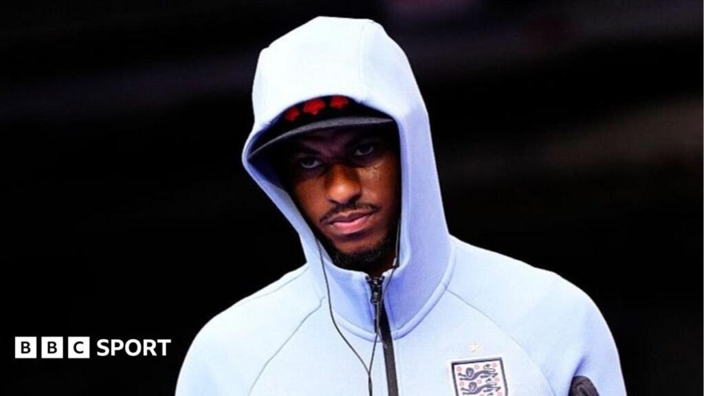 Marcus Rashford: What does the future hold for Manchester United forward? Marcus Rashford wearing a white England zip-up top, hood pulled up over his head