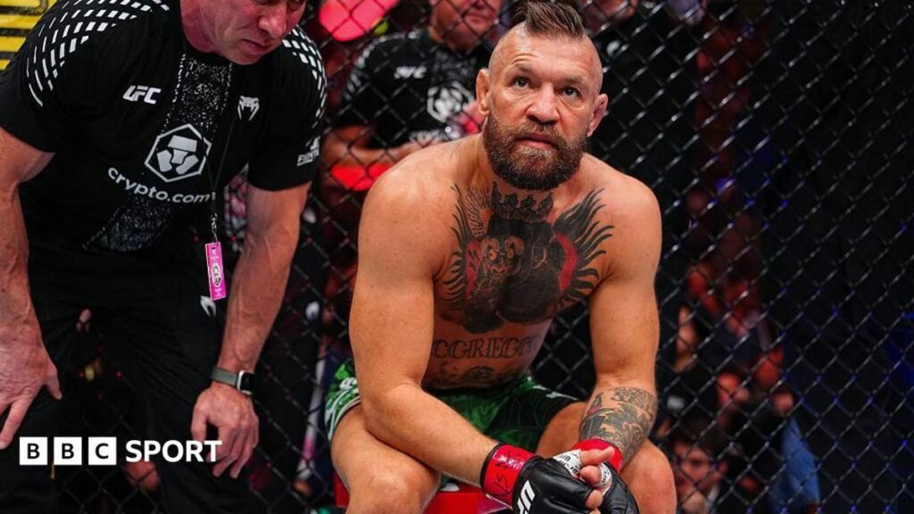 Conor McGregor sits on a stool