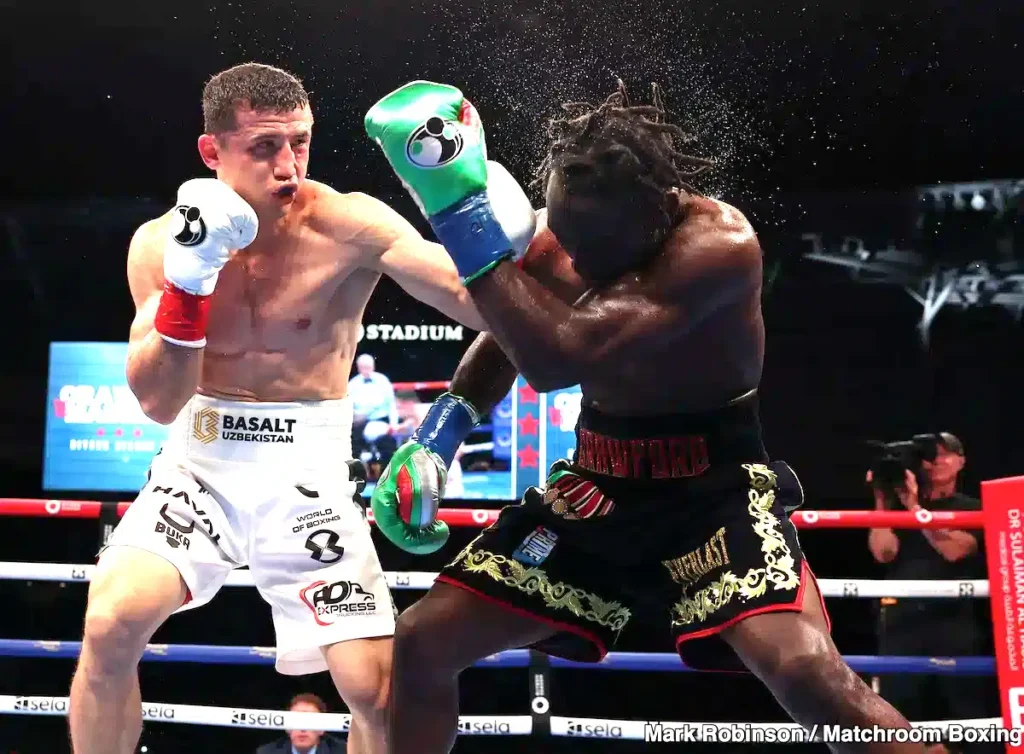 Terence Crawford landing a punch on Israil Madrimov during a boxing match
