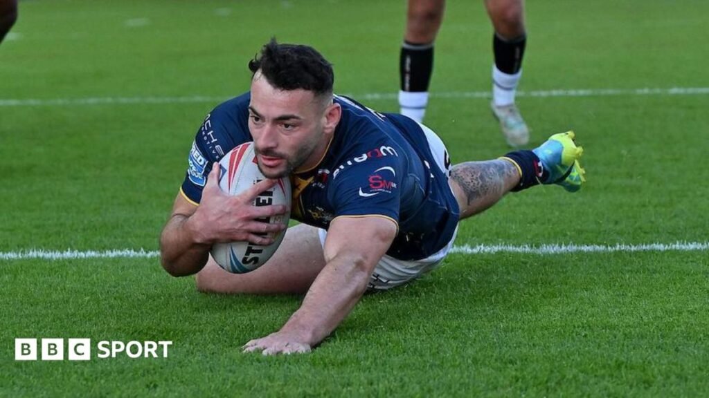 Super League: Leeds Rhinos 46-0 Toulouse Olympique: Jake Connor stars in eight-try rout Jake Connor prepares to touch down for his first try as he slides over the line with ball tucked under his arm