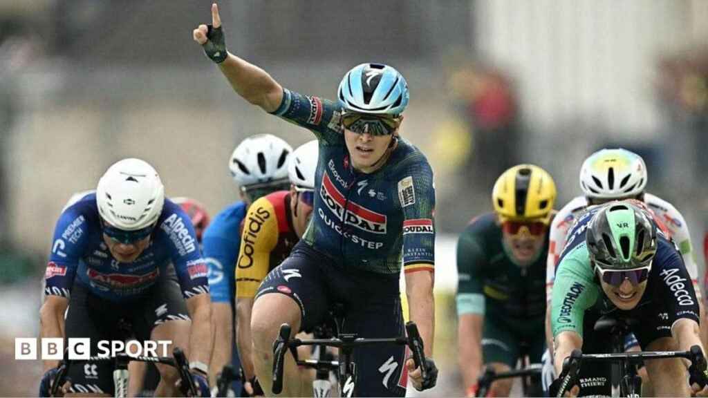 Tour de France 2026: Tim Merlier wins third stage of the year Tim Merlier celebrates winning stage 12 by raising a finger into the air
