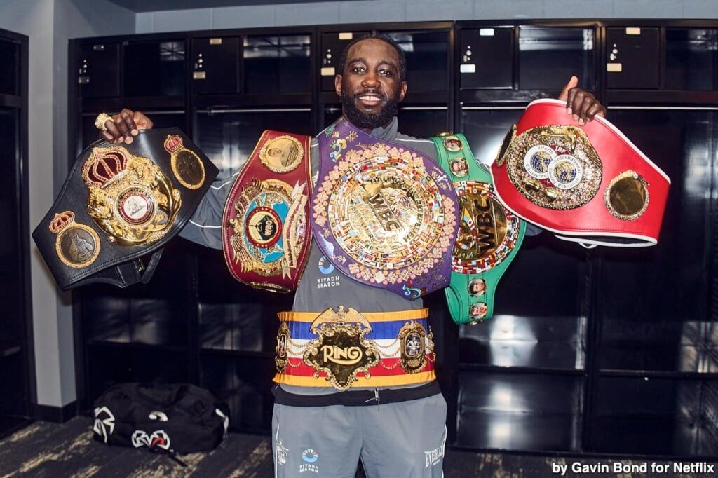 What Does Best Fighter Really Mean? Terence Crawford poses with four championship belts after defeating Canelo Alvarez on September 13, holding the WBA, WBO, IBF, and Ring titles.