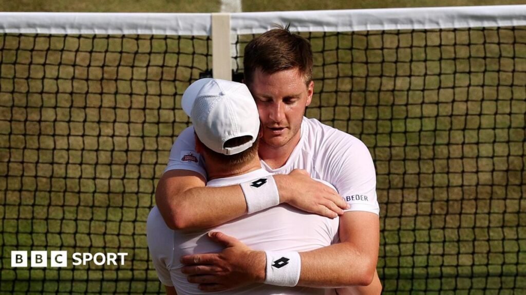 Henry Patten embraces team-mate Harri Heliovaara after winning their semi-final