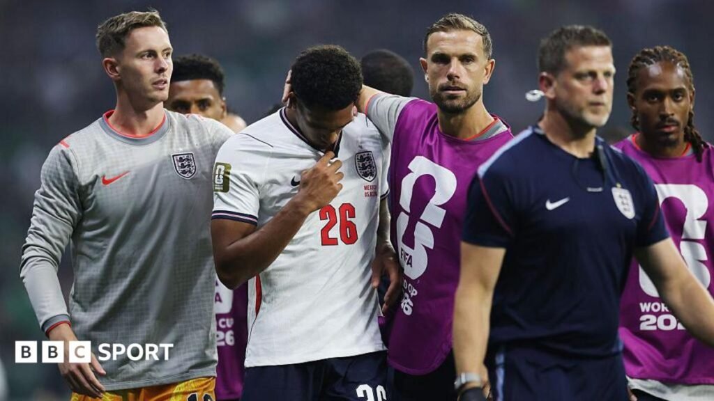 World Cup 2026: England defender Jarell Quansah banned for two games after Mexico red card, Fifa says Jarell Quansah walks off the pitch with his head down after receiving a red card against Mexico