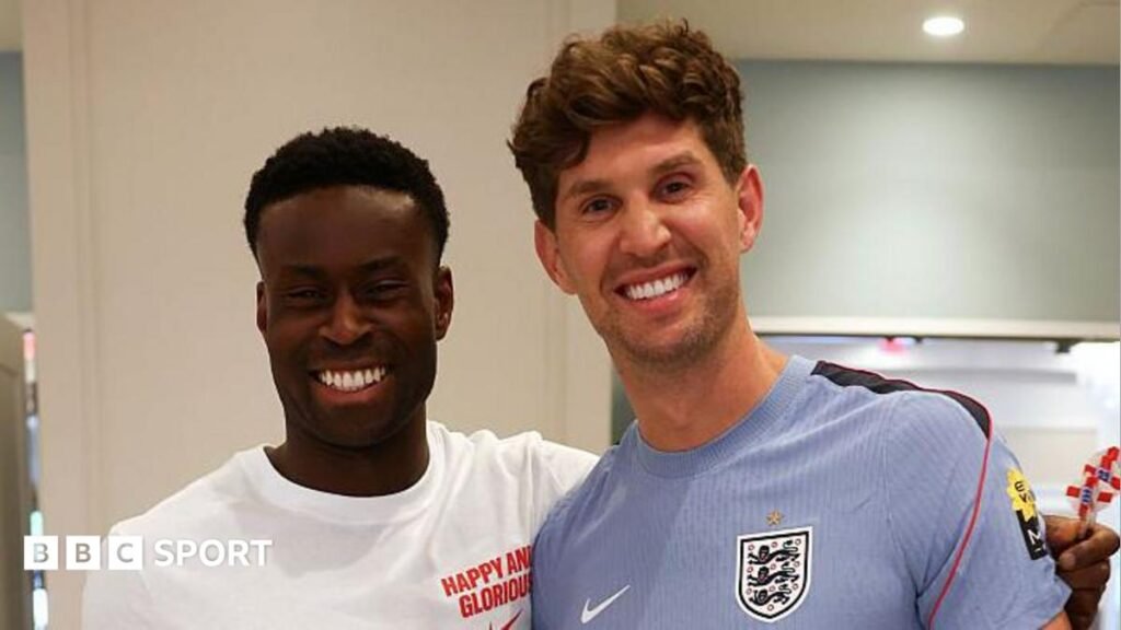 World Cup 2026: England team news – Stones set to start against Norway A picture of Guehi and Stones smiling at the camera at England's training camp in Kansas City