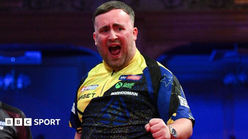 Luke Littler celebrates his nine-darter at the Winter Gardens in Blackpool