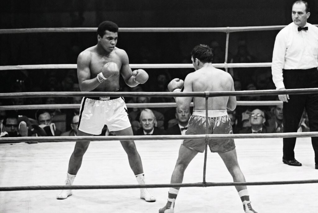 Cassius Clay Dominates Brian London In Three-Round Title Defense Image: Cassius Clay Dominates Brian London In Three-Round Title Defense