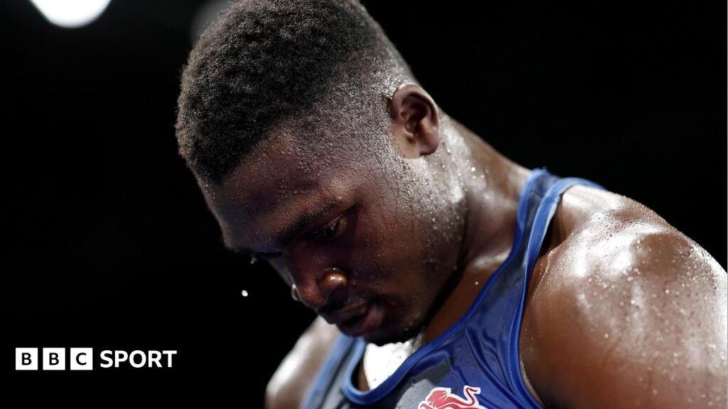 Commonwealth Games 2026: England’s Dimeji Shittu ‘robbed’ in final – is AI judging the answer? Dimeji Shittu, wearing a blue vest, looks down