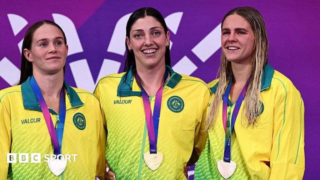 Commonwealth Games medal table: Australia dominate the Glasgow 2026 standings Meg Harris (centre) with two Australia team-mates pose for a photograph after collecting their medals at a swimming medal ceremony