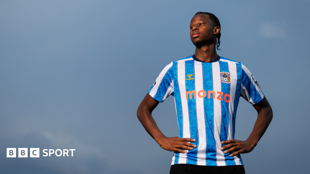 Coventry City: Manchester City defender Stephen Mfuni joins Sky Blues on season-long loan Stephen Mfuni poses in Coventry City's 2025-26 kit