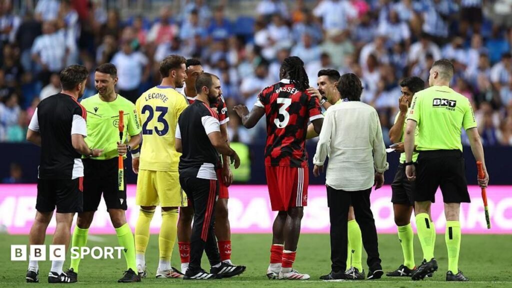 Fulham leave pitch as Malaga take penalty into empty net Calvin Bassey on the pitch at full-time