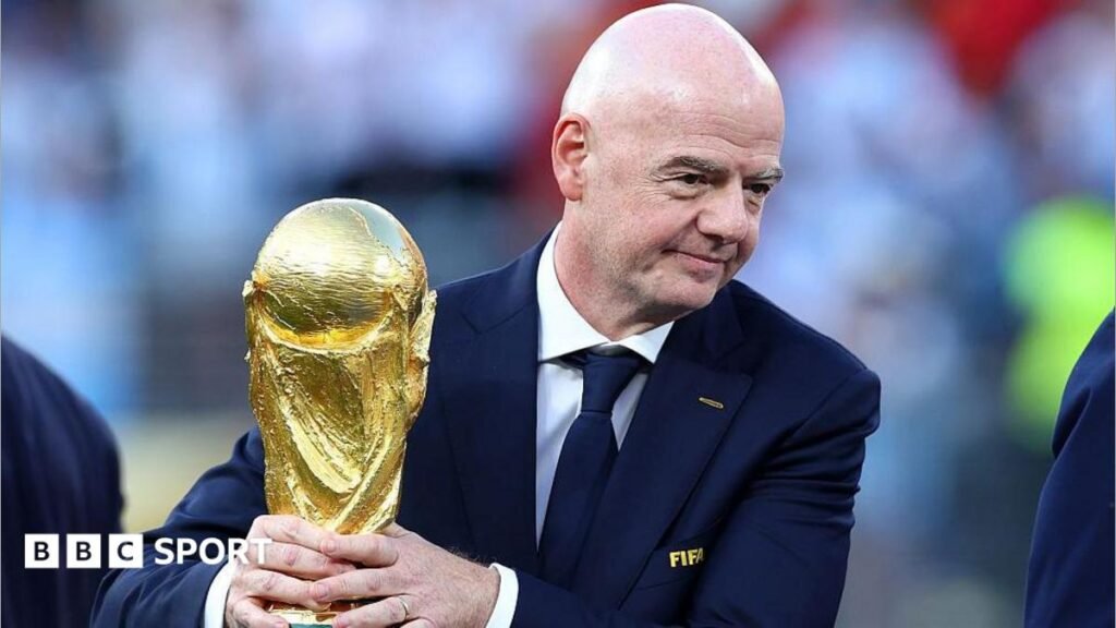 Gianni Infantino: What next for Fifa and its under-pressure president? Gianni Infantino with his hands around the men's World Cup trophy