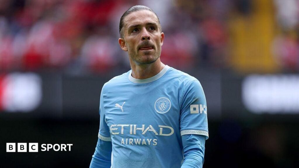 Jack Grealish: Shop window or new chance – what next for Man City winger? Jack Grealish in Manchester City's light blue shirt, on top of an undershirt in the same colours, with his hair slicked back