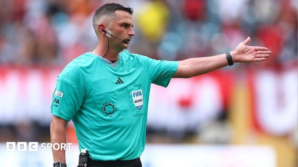 Referee Michael Oliver gestures during the Premier League match between Everton and Manchester City