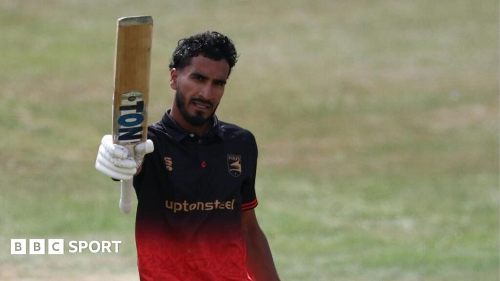 Hamza Shaikh holds his bat up for Leicestershire after scoring a century against Notts Outlaw in the One-Day Cup semi-final