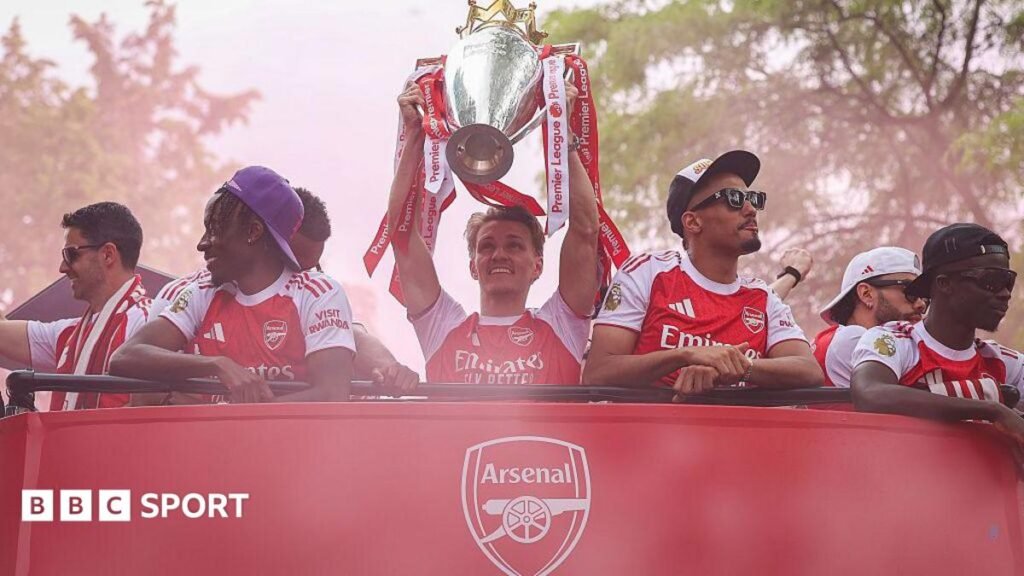 Premier League – how tough will it be for Arsenal to defend their title? Arsenal players celebrate the Premier League title win