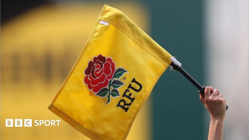 RFU postpones start of England’s community rugby season because of droughts An official holds up a flag with the RFU logo on during the Women's Six Nations match between England and Ireland in Leicester in April 2022